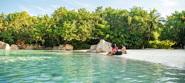 Relaxing on the pristine beaches of Discovery Cove in Orlando Florida